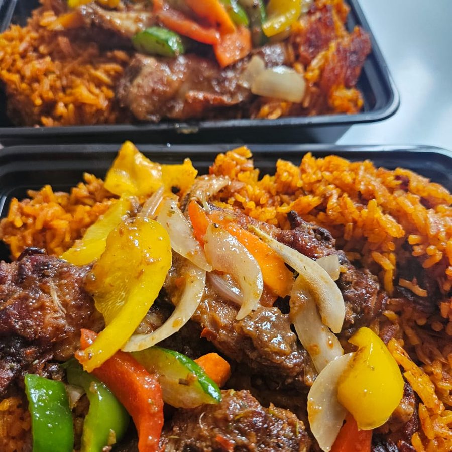 Jollof rice served with beef and mixed peppers